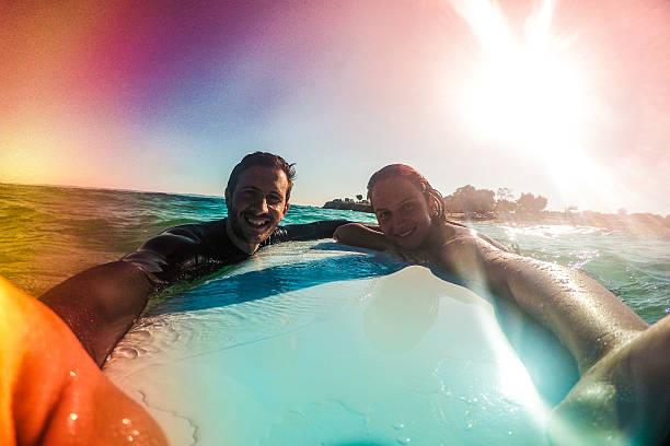 istock Couple of surfers making a selfie 483557608