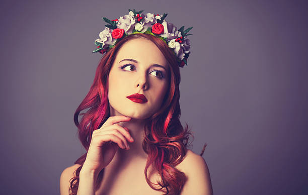 istock Beautiful redhead women with wreath. 483557939