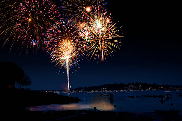 Fireworks show over water stock photo