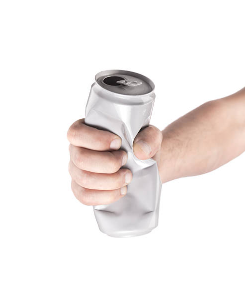 istock Hand with crumpled aluminum cans on a white background 483558580