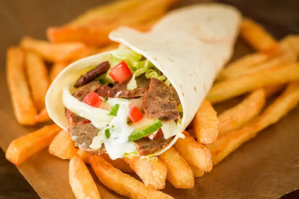 Doner kebab sandwich with french fries