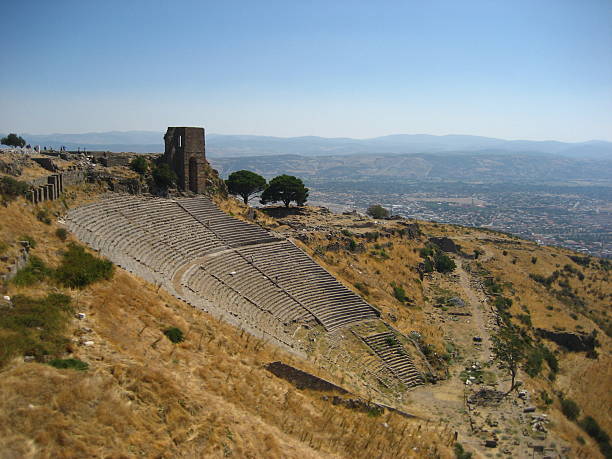 Large Amphitheater at Ephesus, Turkey. Ephesus was the most important Greek city in Ionian Asia Minor. The amphitheater, which holds approximately 25,000 spectators, was completed under the Roman emperor, and is still used as a performance space.