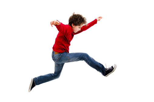 Boy jumping - studio shot