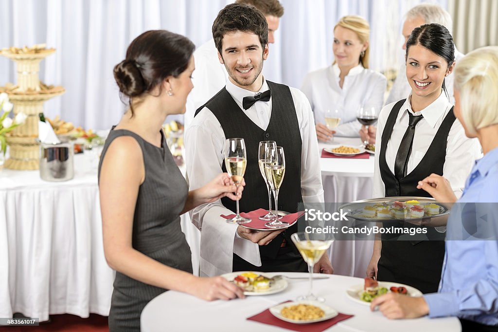 Catering service at company event offer food Catering service at business meeting offer food refreshments to woman Caterer Stock Photo