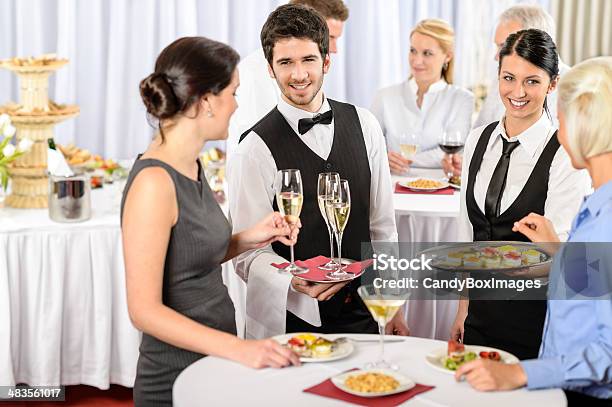 Catering Service At Company Event Offer Food Stock Photo - Download Image Now - Caterer, Waiter, Buffet