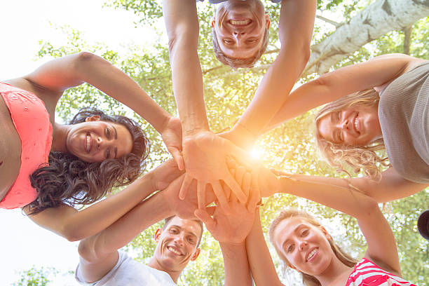istock Group of Friends with hands in hands 483561042