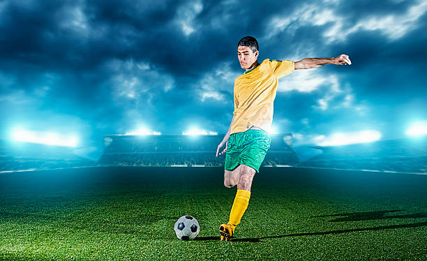istock Soccer player in a stadium kicks football 483561113