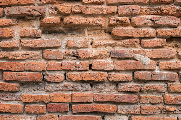 istock Old red brick wall in the wall of old building. 483561116