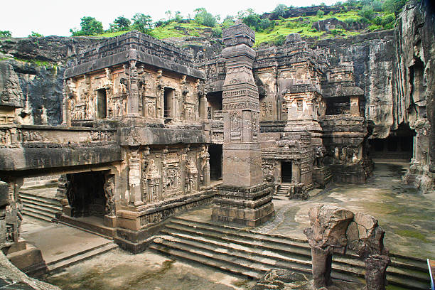 A series of ancient historic Buddhist Cave Temples. Caved into the side of the mountain in Arrangabad, in the Indian state of Maharashtra. India. A UNESCO World Heritage Site, and one of the major tourist destination in the region. Photographed on location inside the cave site in Ellora in horizontal format.