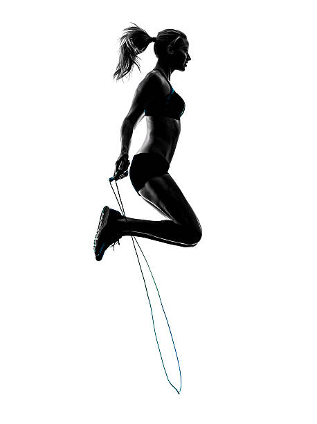 istock woman Jumping Rope exercises silhouette 483562184