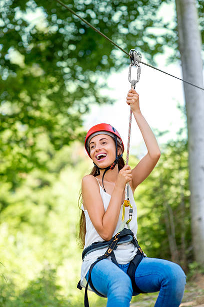 istock Woman riding on a zip line 483563968