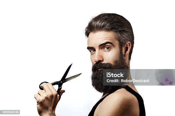 Bearded Man Holding Scissors And Wearing Undershirt On White Background Stock Photo - Download Image Now