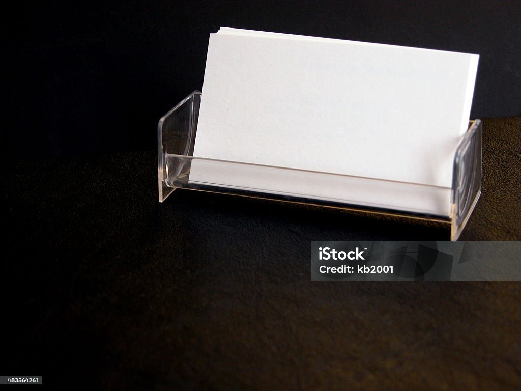 Business Cards BLANK business cards on a black background in a holder.<br> Advertisement Stock Photo