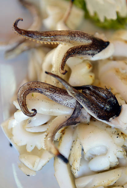 Squid tentacle, Malaysia skewer snacks at Jalan Alor local street food stall in Kuala Lumpur\n.