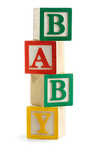 "baby" empilhados ortografia de alfabeto brinquedos de blocos de aprendizagem, a tocar - fotos de bloco imagens e fotografias de stock