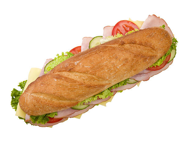 Ham and cheese sandwich 12" submarine with ham, swiss cheese, lettuce, tomatoes and cucumbers, viewed from the top, on white background ham and cheese sandwich stock pictures, royalty-free photos & images