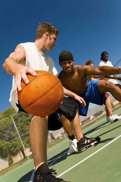 istock Men Playing Basketball On Court 483575045