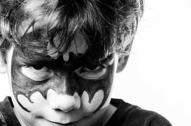 istock Close-up of litlle boy with painted mask 483575081