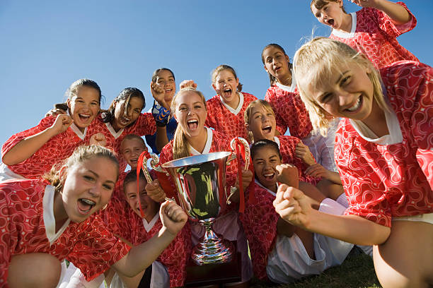 Victorious Soccer Team with Trophy
