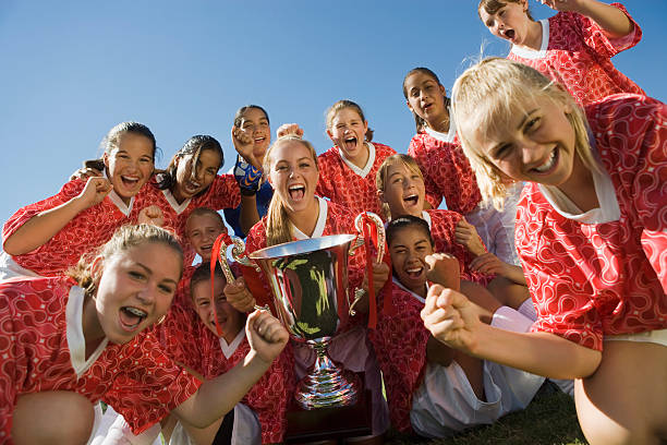 Victorious Soccer Team with Trophy Victorious Soccer Team with Trophy soccer team stock pictures, royalty-free photos & images