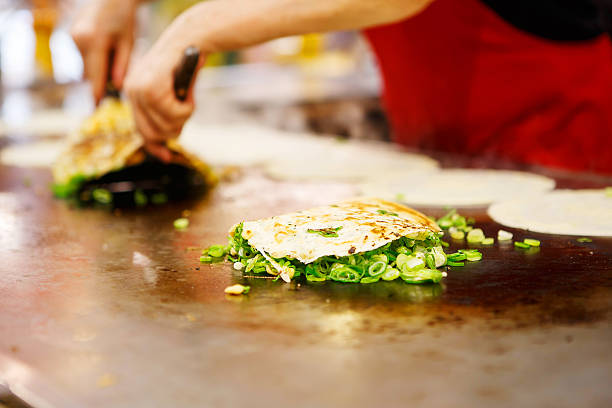 Japanese food okonomiyaki , Japanese pizza Japanese food okonomiyaki , Japanese pizza. Traditional food in Hiroshima, Japan takoyaki photos stock pictures, royalty-free photos & images