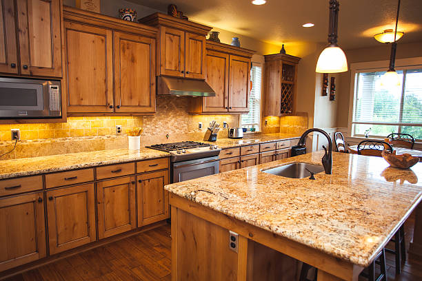 istock Beautiful Home Kitchen Clean Spacious Counter Top and Cabinets 483576357