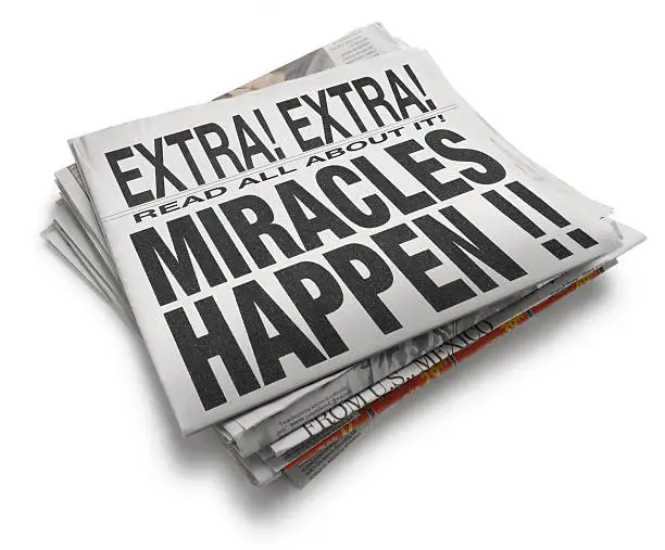 A newspaper with the headline " Miracles Happen".