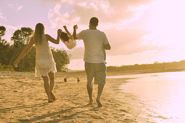 istock Parents swing child in air 483583595