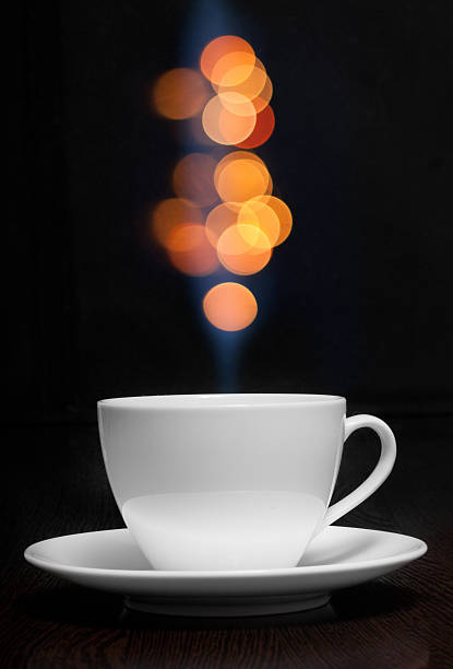 Coffee cup with smoke and abstract bokeh