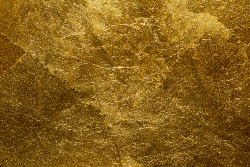 Gold painted stone wall texture.