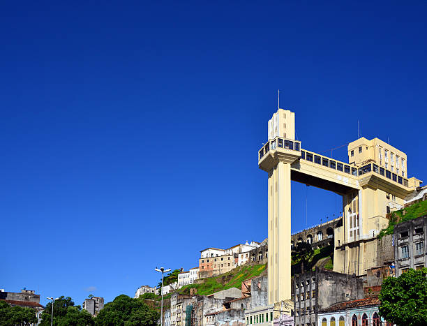 Salvador da Bahia, Brazil - Lacerda elevator Salvador da Bahia, Bahia, Brazil: Lacerda elevator with vast copy space - seen against the cliff that separated the Lower Town and the Upper Town - photo by M.Torres lacerda elevator stock pictures, royalty-free photos & images