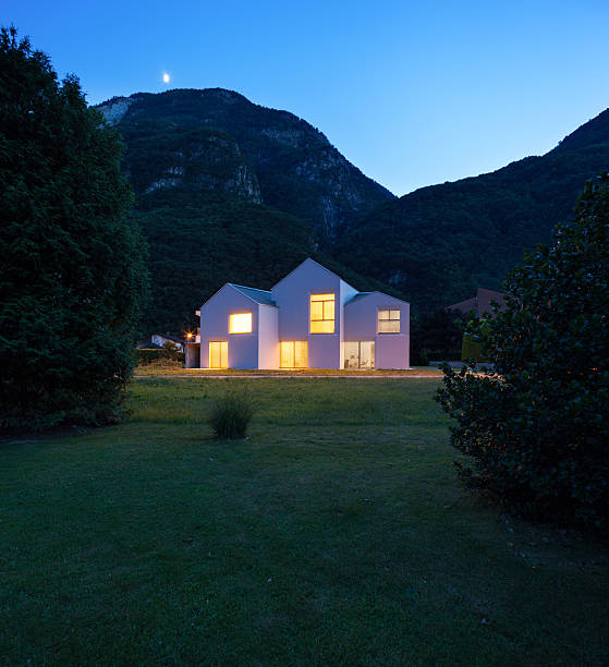 istock modern houses by night 483592360