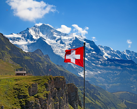 Swiss flag on the top of Mannlichen (Jungfrau region, Bern, Switzerland)