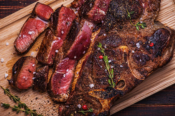 istock Beef steak on  a wooden background 483595248