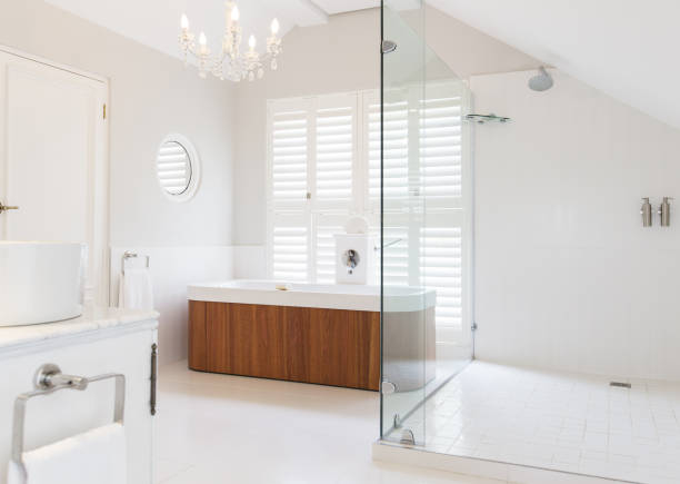 istock Chandelier over soaking tub in modern bathroom 483596269
