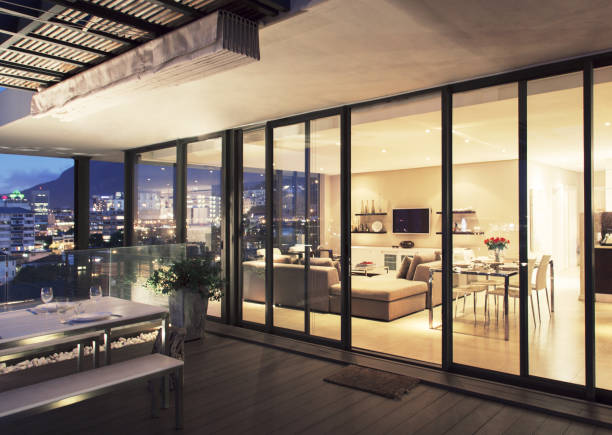 istock Illuminated modern living room and patio 483596451