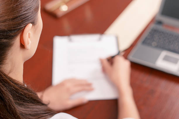 istock Pleasant secretary signing papers 483596690