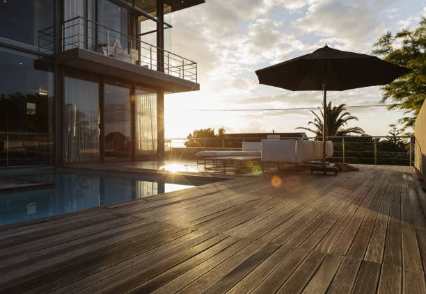 istock Sun behind luxury house with swimming pool 483599469