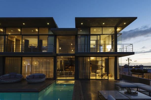 istock Luxury house with swimming pool illuminated at night 483599477