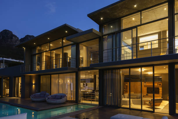 istock Luxury house with swimming pool illuminated at night 483599489