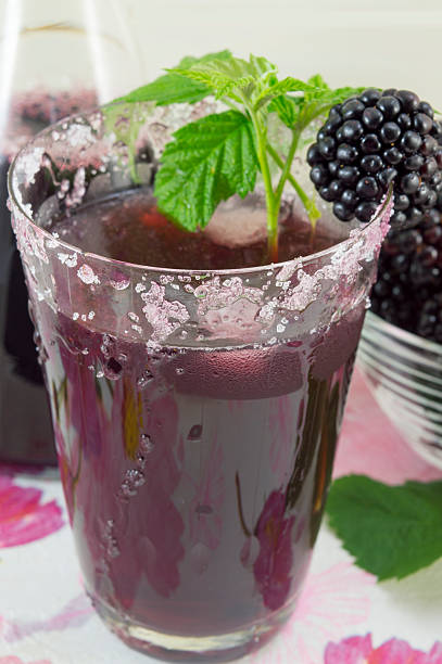 istock Fresh blackberry juice decorated with blackberry, sugar and blac 483602958