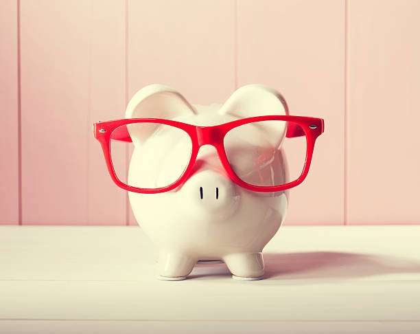 istock Piggy bank with red glasses 483603550