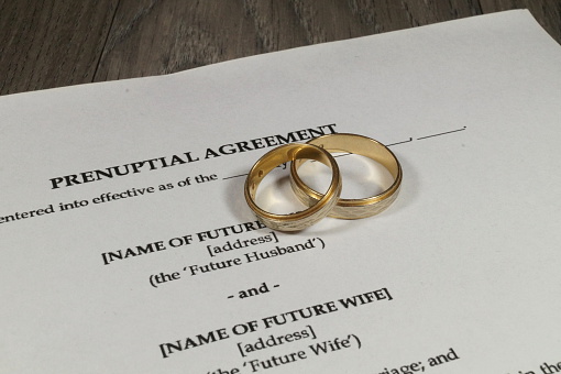 A marriage contract with two golden wedding rings