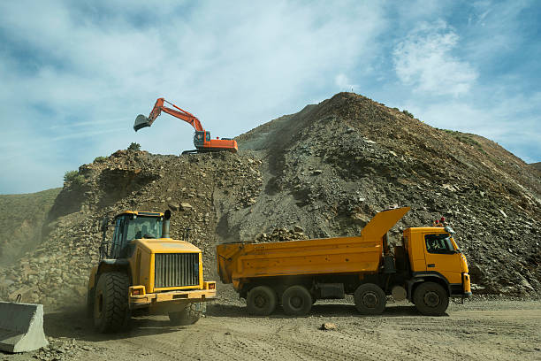 istock Yellow Excavator, Truck and Bulldozer Constructing Road, Morocco 483611932