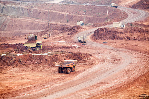 istock Part of a pit with big mining truck working 483612024