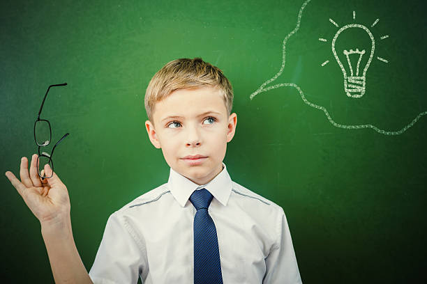 istock Creative and smart schoolboy has an idea at blackboard 483613428