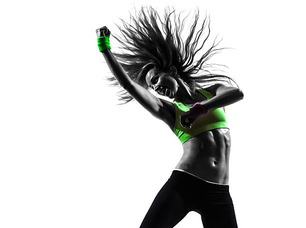 woman exercising fitness dancing silhouette one caucasian woman exercising fitness dancing in silhouette isolated on white background zumba image stock pictures, royalty-free photos & images