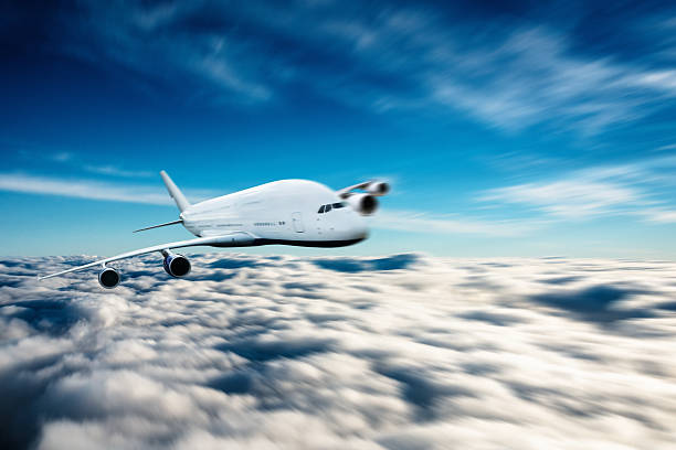 istock commercial airplane flying on the clouds 483613986