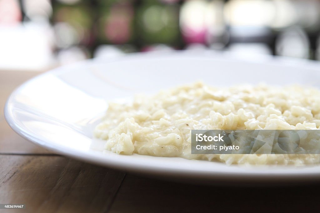 risotto dish with herbs on wood background Arborio Rice Stock Photo