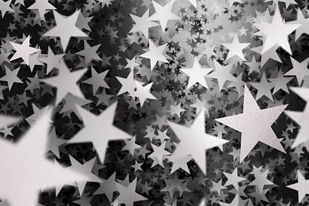 istock Hundreds of falling silver confetti stars 483614633